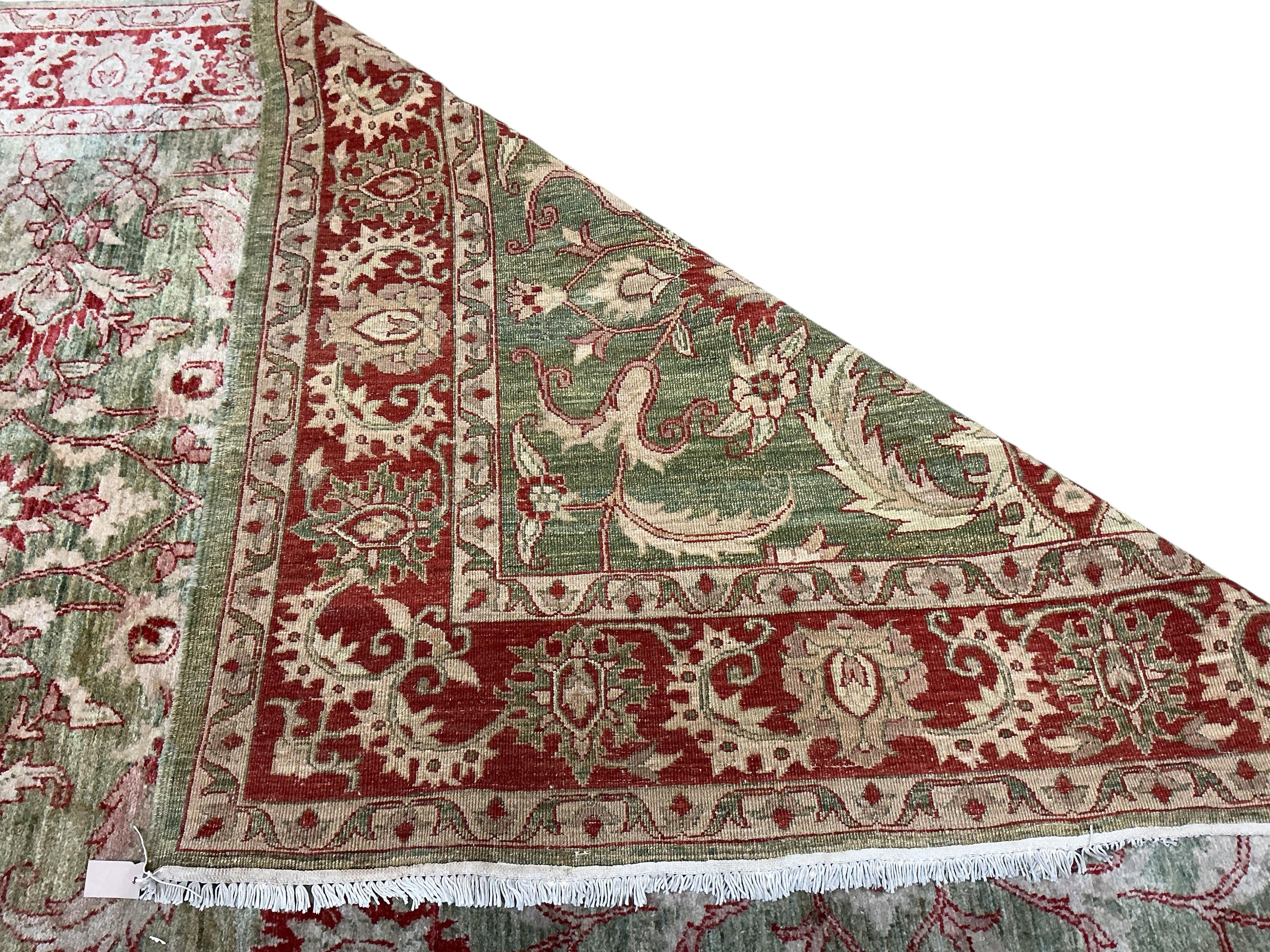 A Zeigler style pale green ground carpet, 340 x 204cm